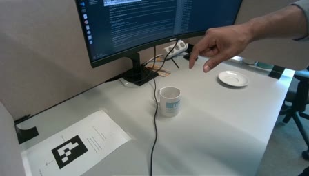 First frame of a real recording: the mug and plate on the desk